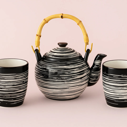 Teapot en bekers - ambachtelijke elegantie en kostbare vraatzucht